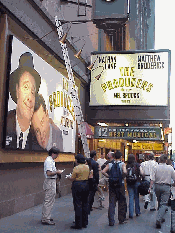 Center right picture you see workers with a ladder near the smash Broadway hit, The Producers.  This is the winning show on Broadway.  Tickets to The Producers are still hard to find. 