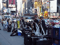 The sights, the sounds of Broadway fill the evening air.  Bottom right picture you see street entertainers on Broadway.