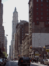 Center right picture you see Broadway in lower Manhattan.  This is a few blocks away from the area of the World Trade Center Disaster.  In the distance you see the Woolworth Building, which is one of the first high-rises in New York City.