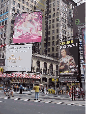 Top right you see a corner of Broadway and a billboard for Mariah Carey.  There are many famous people that live in NYC and Maria is one of the many native New Yorkers.