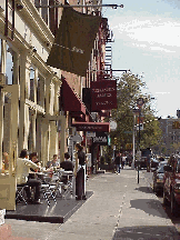 Center right picture you see people dining at a restaurant on Houston Street on a warm October day.