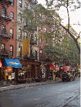 Center right picture you see a long shot of MacDougal Street.  You'll find little bars and clubs tucked away at street level.  You'll pass by jewelry stores, delis and music stores.  Of course the restaurants in the village are some of the most famous.