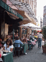 Center right picture you see people enjoying lunch on the sidewalk of Mulberry St.  The prices for lunch in Little Italy are very reasonable and the choices of restaurants are almost endless.