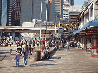 Center right photo you see people on the pier at South Street Seaport.  This is a wonderful place to shop at the huge mall on the pier, and dine overlooking views of the Brooklyn Bridge and the skyline.