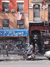 Center right picture you see a motorcycle on Avenue A in the East Village near Tompkins Square Park.  You'll notice the American flag in the window.  It would be difficult to look one city block and not see an American flag.