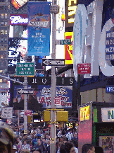 Center right picture you see a picture taken on Broadway and West 46th Street.  As you can see there are signs,  people, and lights everywhere!