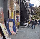 Center right photo you see where you can find that painting of a woman with blue hair that you've been looking for, it's on West Broadway!