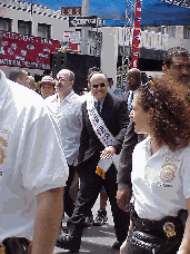 Center right picture you see Mayor Giuliani in a parade back in the summer.  Our Mayor has guided the city through one of the most difficult times in history.  Mayor Giuliani won't be mayor much longer so we wish him the best of luck and thank him.