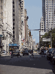 Top right photo you see Broadway near Chambers Street and City Hall.  This is a really pretty area of downtown where you'll see the famous Woolworth Building and the majestic Brooklyn Bridge.