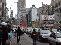 Top right picture you see Canal Street looking East.  All along this crowded street you'll pass by vendors selling their merchandise from push carts.  The problem for them is that these sales are cash and carry, so when tourism suffered they suffered.