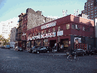 Bottom right picture you see Little West 12th Street.  The spacious old warehouses have been painted, decorated and reopened to wealthy clientele and tourists. You even see buses and walking tours. The butchers must wonder what all the fuss is about.