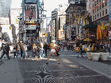 Bottom right picture you see the soundless musical sensation posing in the center of Times Square.  Wonder if his Mother knows?