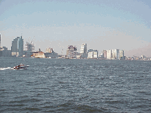 Center right  picture you see the shoreline with the view of New Jersey across the Hudson River.  Many people live in New Jersey and take the ferry to work into Manhattan daily.