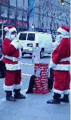 Top right picture you see a couple of Santa's helpers in a high level discussion on the big delivery job coming up on Christmas Eve. In the background you see the studios of the NBC Today Show at Rockefeller Center.