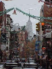 Top right you see the Empire State Building in the distance on Mulberry Street. The restaurants of Little Italy will be open and they hope you'll stop by for lunch or dinner.