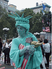 Top right picture you see a woman dressed as the Statue of Liberty.  She worked for days at the memorials raising money for the rescue workers.