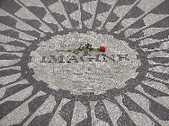 Center right picture you see the memorial to John Lennon at Strawberry Fields in Central Park.  Recently when George Harrison died, people gathered here to remember him.