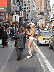 Bottom right picture was taken a couple of days ago when it was really cold.  Only a few weeks ago we showed you pictures of this guy. We were surprised to see him once again posing in his underwear in Times Square. However, he does make a lot of money.