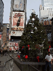 Top right is another picture that was taken only a few days ago in Times Square.  You see the Broadway Christmas Tree in the center.