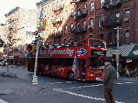 Center right picture you see a tour bus making it's way along Bleecker Street.  This might be a fast way to see this famous street, but it's certainly not the most fun.  You have to get off the bus folks!