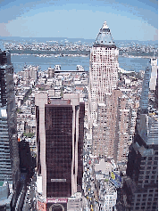 Center right picture was taken on a rooftop looking down on Hell's Kitchen in the Theater District.  The tall building is  Worldwide Plaza and the Crowne Plaza Hotel is to the left.