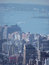 Top right picture was taken from a rooftop in midtown zooming in on the other end of the island.  That's the Statue of Liberty you see in the far distance on the right.