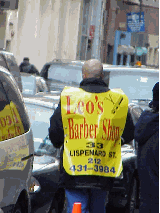 Top right photo you see a man in Chinatown advertising a nearby barber shop.  You really get your moneys worth!