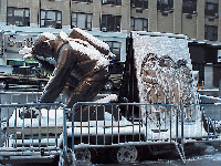 Center right photo you see the Statue Memorial to the Fireman in Hell's Kitchen.  You can see the dusting of light snow on the gorgeous statue that is parked in front of the Milford Plaza on 8th Avenue.