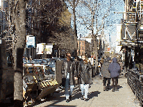 Bottom right picture you see artists selling their work on the sidewalks of Soho.