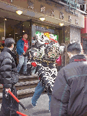 Top right photo you see a dragon blessing a Chinese Restaurant in Chinatown during the Chinese New Year Lion Dance Parade.