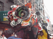 Center right photo you see close up picture of a dragon.  These beautiful characters move very fast and the crowds of people rush to keep up with the action.  It's truly one of the most spectacular events in NYC. Happy New Year!