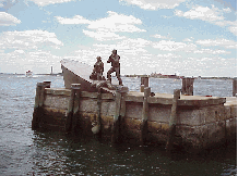 Center right picture you see is as far downtown as you can possibly get!  The center picture is the Merchant Marines Memorial in Battery Park.  In the very far distance is the Statue of Liberty. This is one of the most beautiful sites in the city!