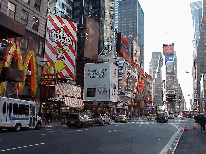 Bottom right picture you see a long shot of Broadway in Times Square.  In the far distance you see the Jumbotron.