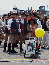 Top right photo you see Minute Men (and a lady of the minute) posing for a picture during the recent Flotilla for Governor's Island.