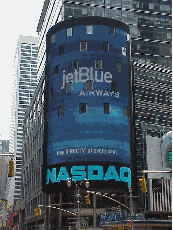 Even companies get a moment to star in NYC.  Top right picture you see a photo of the Nasdaq sign on Broadway showing JetBlue Airways for one second, then another company will be the star.