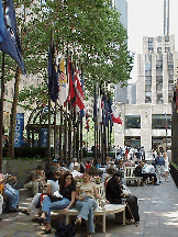 Top right photo you see people lounging around during lunch break at Rockefeller Center.  In the distant background you see the NBC Experience Store. This is where you can buy some really great NYC/NBC souvenirs.