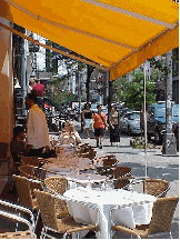 Top right picture you see a restaurant on West Broadway just opening for the lunch crowd.  In a few minutes every table will be taken.  It's very fashionable, and so much fun to dine outside in Soho.