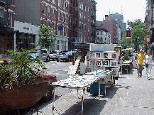 Top right photo you see art on West Broadway.  Across the street in the picture you see the Anne Klein store in Soho.