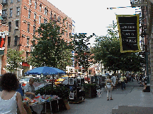 Center right photo you see vendors selling merchandise under umbrellas on a warm day.