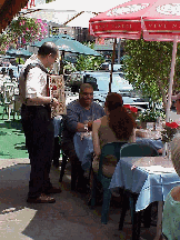 Center right photo you see Caffe Napoli on Mulberry Street where love, music and great food fill the air.