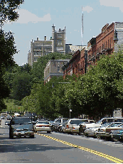 Top right picture you see a quiet tree lined street in Harlem.  In the distance you see City College.