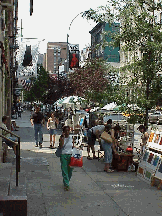 Bottom right picture you see West Broadway in Soho.  As you stroll along in Soho you get to see artwork for sale on the sidewalks.  This is also one of the trendy areas of the city, with expensive stores and restaurants.