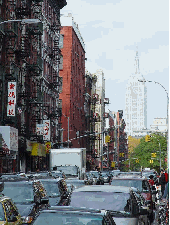 Mott Street and the Empire State Building in the distance