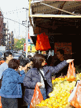 Ladies shopping for fruit in Chinatown