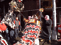 dragons and lion teasers at a New Year's celebration in Chinatown