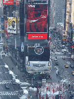 Coke sign in the center of Broadway