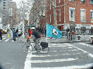 A lone biker making his way past with a peace sign just before the marchers arrived