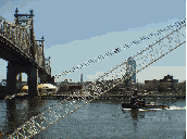 Queensboro Bridge as a tug goes by