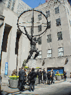 New Yorkers relaxing on Fifth Avenue near the Atlas statue at Rockefeller Center