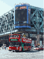 Double Decker bus making its way past the Port Authority in the Clinton area